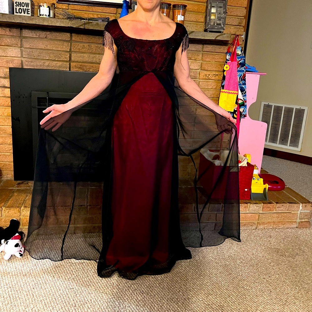Red and black gown black chiffon overlay red under and beaded cap sleeves